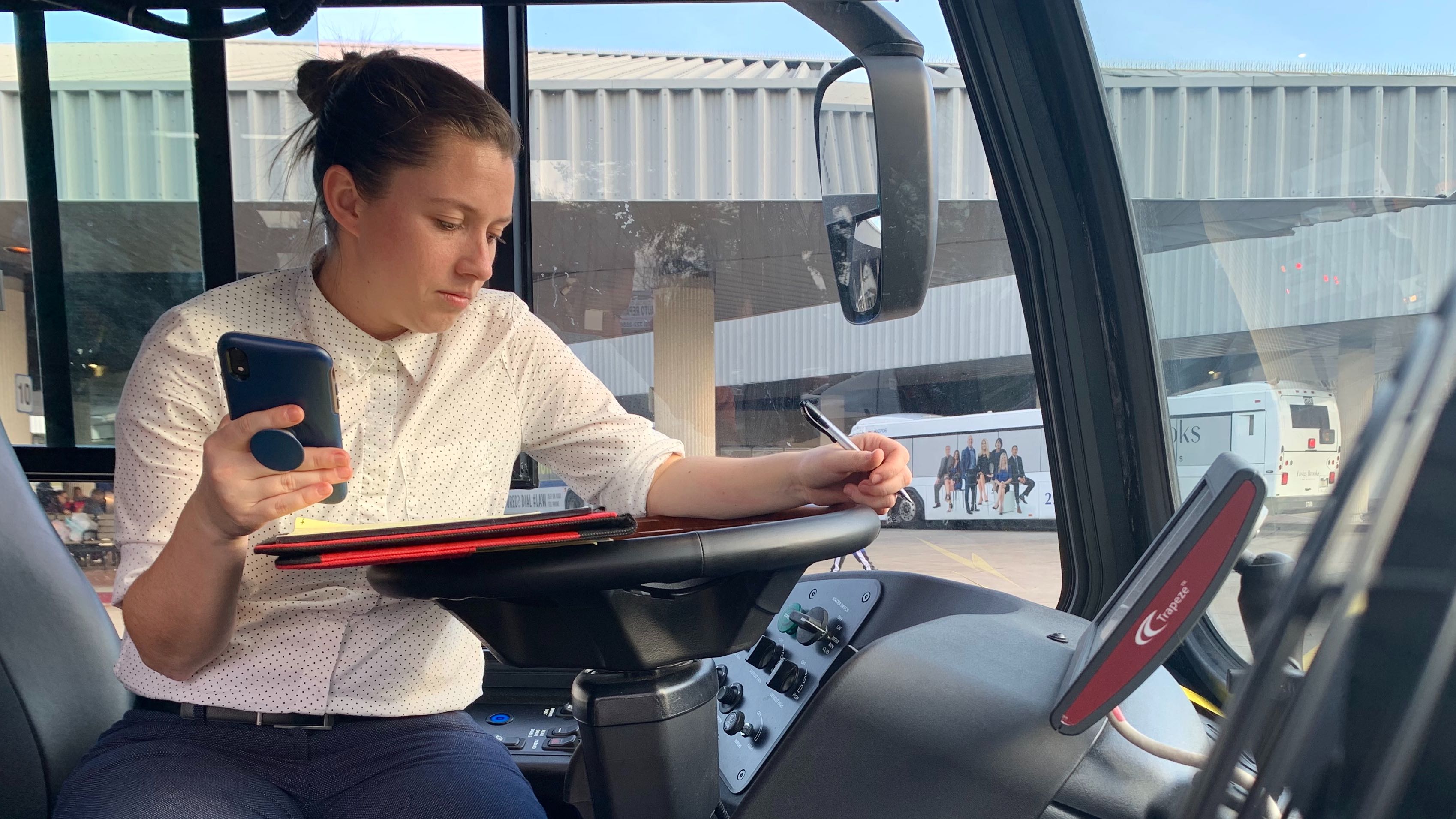 A CTE associate tests a fast charging system to review and monitor the infrastructure supporting the entity's electric buses