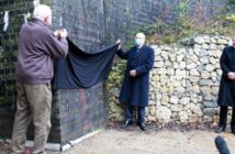 At the Catesby Tunnel opening, Mike Costin and Peter Wright unveil a plaque on the outside wall of the facility