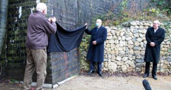 At the Catesby Tunnel opening, Mike Costin and Peter Wright unveil a plaque on the outside wall of the facility