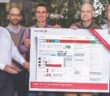From left to right: Peter Decker, Vector's CAN product manager, presents the new CAN XL poster to Gregor Sunderdiek, IP product manager for Bosch, Dr Arthur Mutter, chairman of the CAN XL working group at CAN in Automation e.V. (CiA) and senior exec for networking technologies at Bosch, Florian Hartwich,  senior consultant for networking technologies, Bosch, and Andreas König, Bosch's director of Intellectual Property