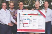 From left to right: Peter Decker, Vector's CAN product manager, presents the new CAN XL poster to Gregor Sunderdiek, IP product manager for Bosch, Dr Arthur Mutter, chairman of the CAN XL working group at CAN in Automation e.V. (CiA) and senior exec for networking technologies at Bosch, Florian Hartwich,  senior consultant for networking technologies, Bosch, and Andreas König, Bosch's director of Intellectual Property
