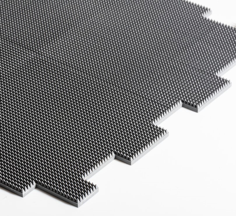 Compact surface-textured absorber materials 