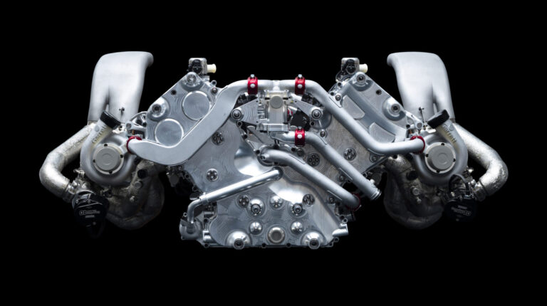 The GMR 001 engine shown in isolation against a black background