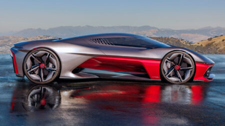 GM reveals Corvette concept hypercar inspired by Southern California A sideview of the latest Corvette concept ca, inspired by Southern California. The car is sleek, grey and red, and is on an empty road in a rural location, with California hills in the background