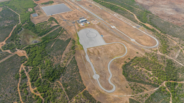 Smithers Earns ISO 17025 Accreditation at Proving Grounds in Pearsall, Texas, shown here in an aerial show, with winding test traks surrounded by brown and green land.