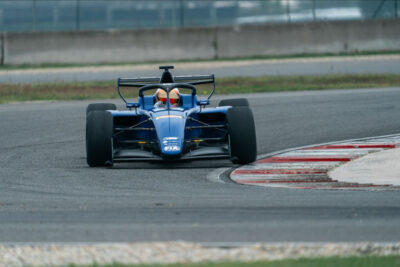 Tatuus T-326 driving on a race circuit 