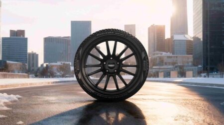 Promo pic of the new Pirelli Cinturato Winter 3, in front of an urban setting at sundown