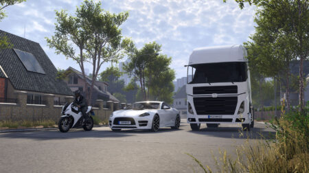 Screenshot of IPG's CarMaker with a motorcycle and rider, a car, and a truck, on a street.