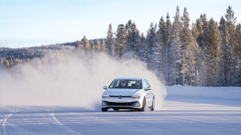 A test driver takes a journalist out for a spin at Nexen Tire's new hub.