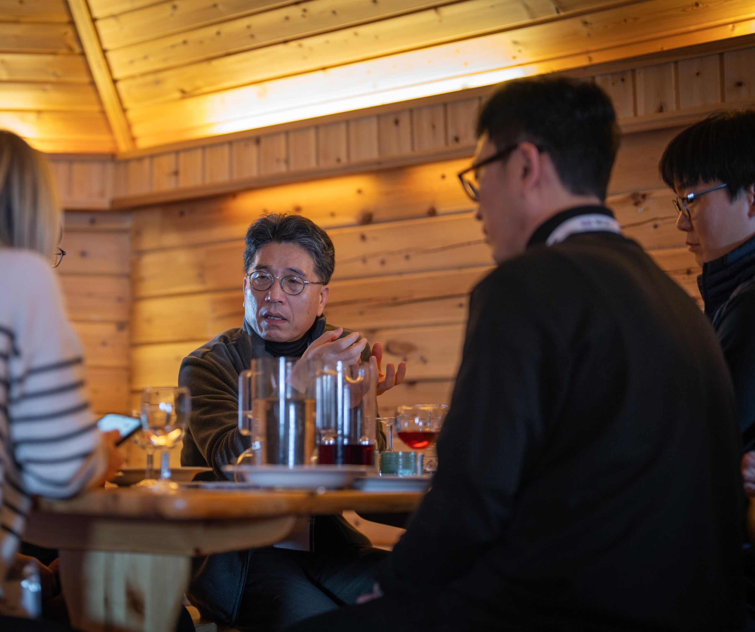 Brad Kim, CTO of Nexen's R&D Center in Seoul, discusses the new facility over lunch at the opening.