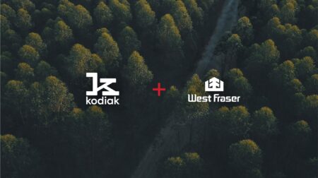 Kodiak AI and West Fraser Timber logos on an image of Canadian forest.