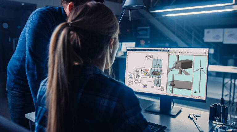 MathWorks develops Renesas hardware support packages for rapid prototyping of embedded systems Engineer working on desktop computer, screen showing CAD software with technical blueprints. The project manager explains job specifics in an industrial design engineering facility office.