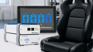 The Göpel Electronic the SmartController pictured in promo pics with a display screen behind it and a automotive chair on the right hand side.