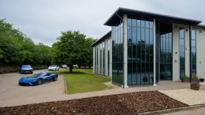 Exterior shot of the glass-fronetd Nio R&D center in Oxfordshire in the UK.