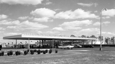 “I still find myself amazed at what goes on here on a daily basis” – Mark Reuss, GM Black and white photo of the General Motors Global Technical Center, with the name written above the entrance alongside the phrase "Where today meets tomorrow".