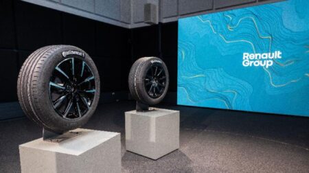 The bespke Continental tire for Renault sits on a plinth in front of a large projector screen as part of the Renault Group’s “Sustainability Tour.