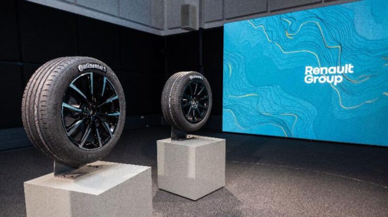 The bespke Continental tire for Renault sits on a plinth in front of a large projector screen as part of the Renault Group’s “Sustainability Tour.