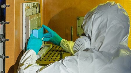 A Fraunhofer EMI employee placing battery inside x-ray.