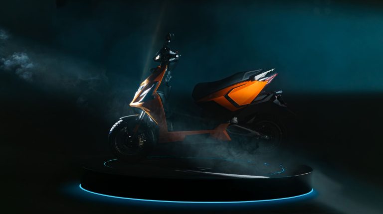 A small orange and black electric two-wheeler from Indian manufacturer Simple Energy, against a black background.