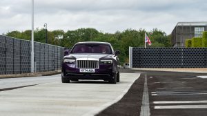 A Rolls-Royce vehicle drives along the new testway at the company's Goodwood base.