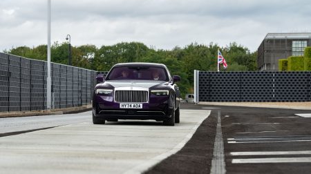 A Rolls-Royce vehicle drives along the new testway at the company's Goodwood base.
