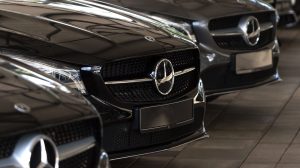 Front end of a dark Mercedes-Benz vehicle.
